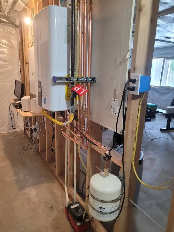 Licensed plumber repairing a kitchen sink in Richmond